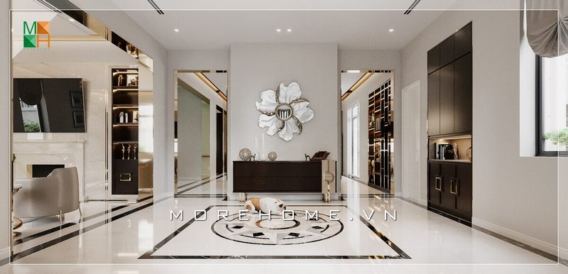 Mẫu thiết kế phòng khách cho biệt thự, với cửa thông phòng được bọc khung inox mạ vàng sang trọng, bức vách ở giữa treo gương hình hoa kiểu dáng cổ điển cao cấp, mỗi chi tiết góp phần mang đến vẻ đẹp tân cổ điển cho không gian căn phòng